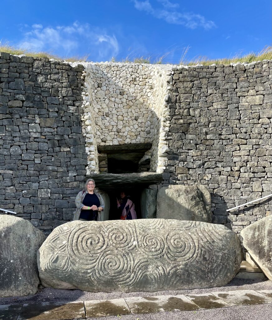 Jill McMullen standing at entrance to Newgrange passage tomb